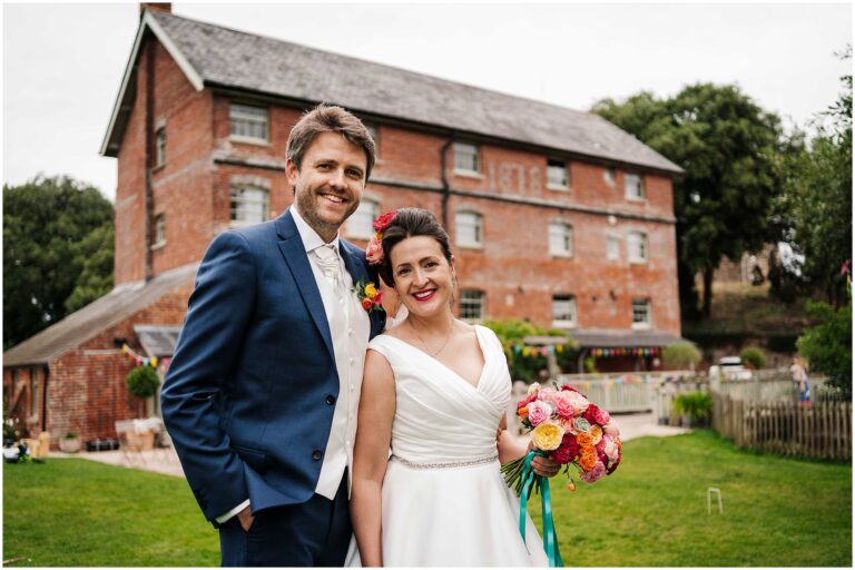 Sopley Mill Wedding Photography - Bride & Groom portrait in front of Mill